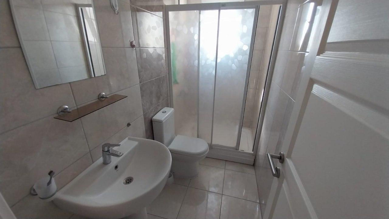 Finished bathroom with a shower enclosure